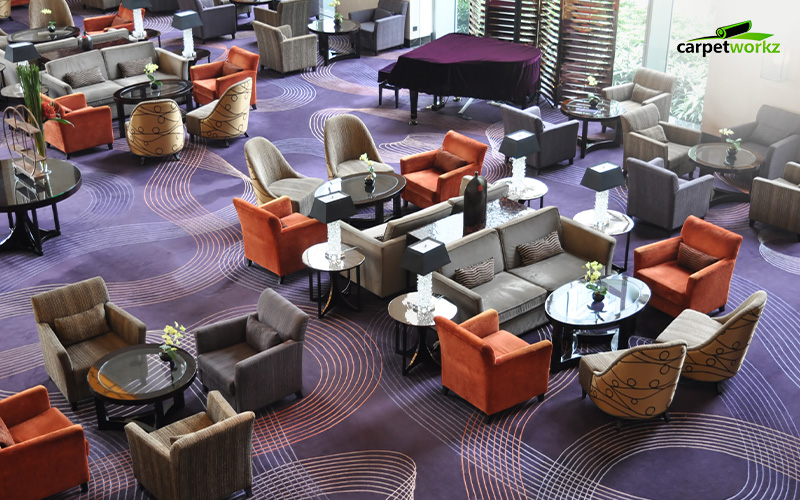 Luxury hotel bar lounge with dark colored carpet