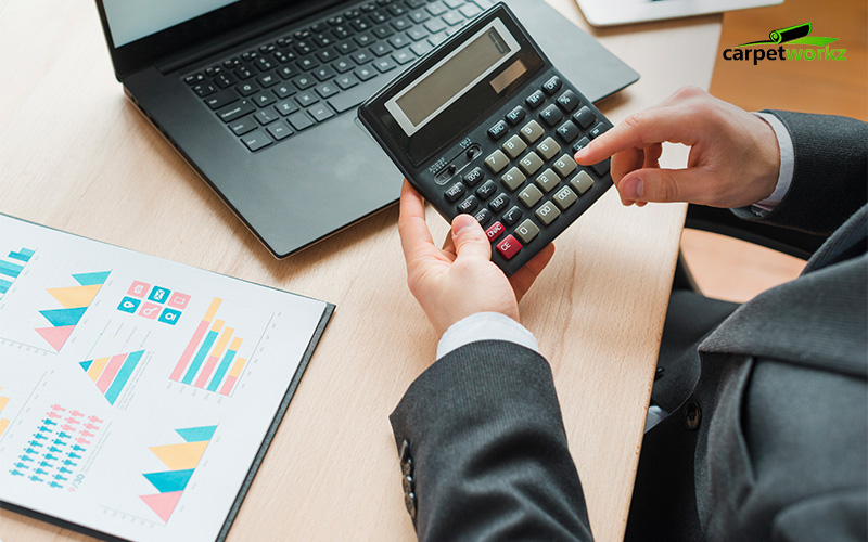 Business Man Using Calculator with Computer Laptop