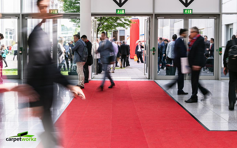 Image of moving business people in a international exhibition