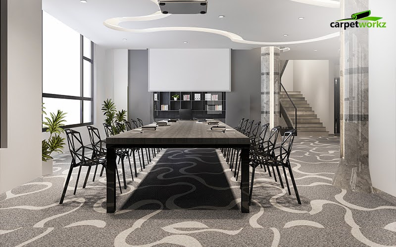 A modern conference room with a long black table, sleek chairs, and a carpet layout that subtly guides movement through flowing patterns.